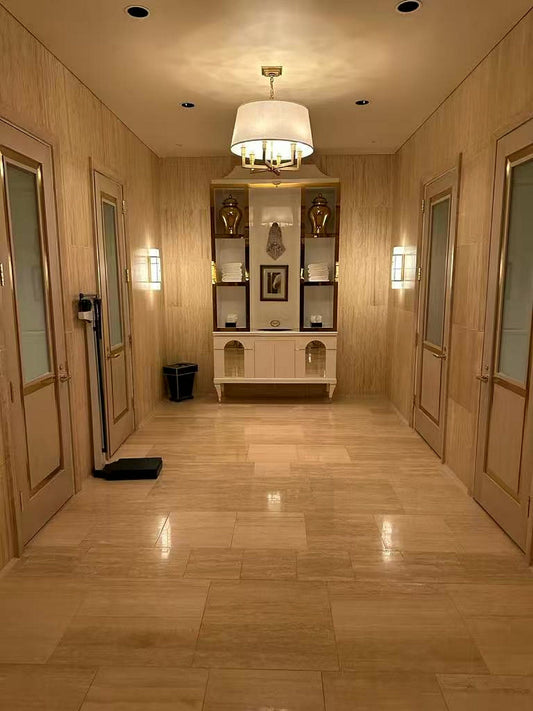 Installed beige travertine wall tiles in a hotel spa corridor