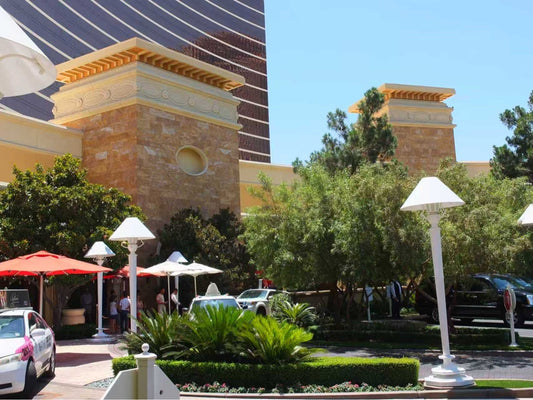 Golden travertine stone cladding on exterior pillars and facade