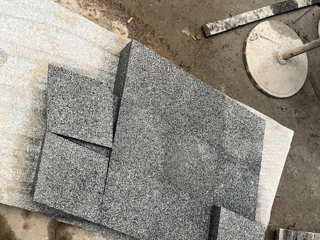 Grey granite tiles cut to size and stacked at the factory for an outdoor project