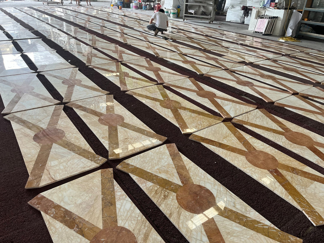 Factory dry-lay overview: Golden Spider + Valencia Cream waterjet floor modules laid out for inspection