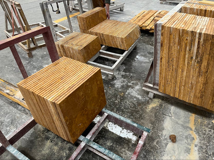 Stacks of finished golden travertine tiles ready for packing at Ji Yuan Stone factory
