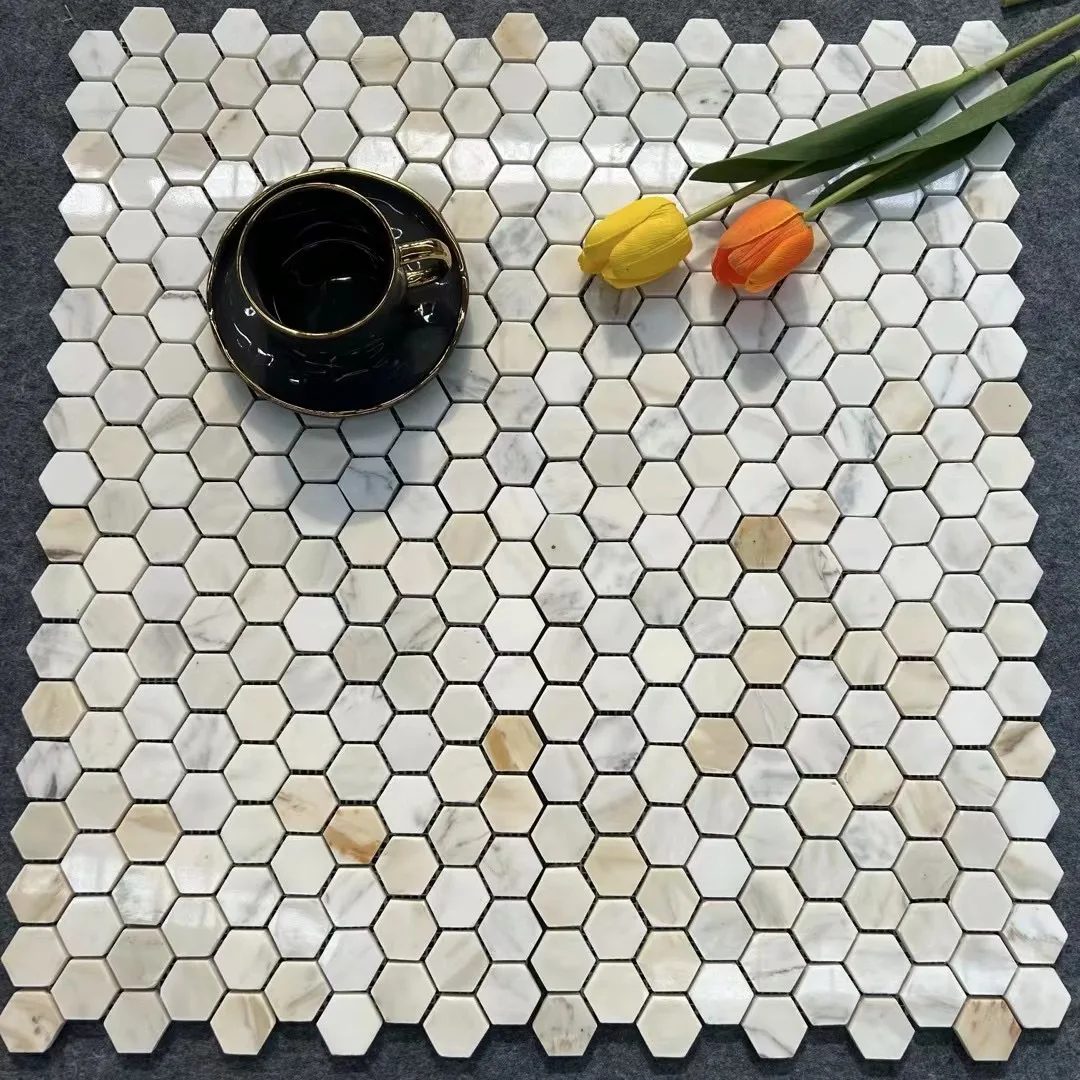 Calacatta Gold hexagon mosaic sheet styled with a cup and tulips