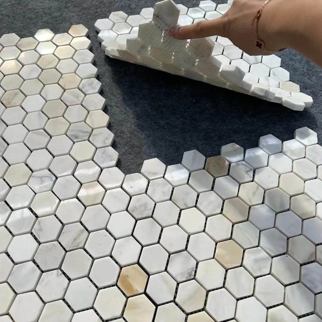 Mesh-backed Calacatta Gold hexagon mosaic sheets