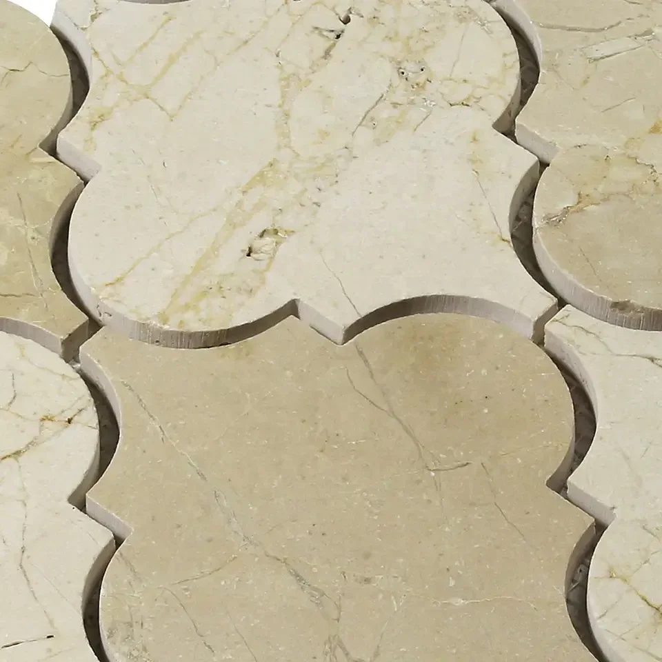 Close-up of Crema Marfil lantern mosaic showing beige tones and veining