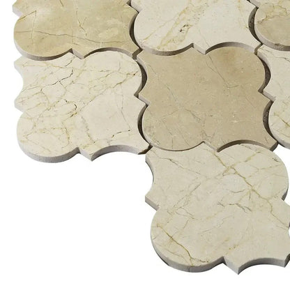 Angled close-up of Crema Marfil lantern mosaic surface
