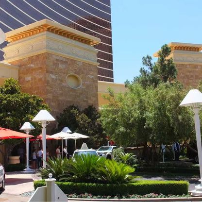 Golden travertine exterior wall cladding after installation on a luxury hotel entrance facade